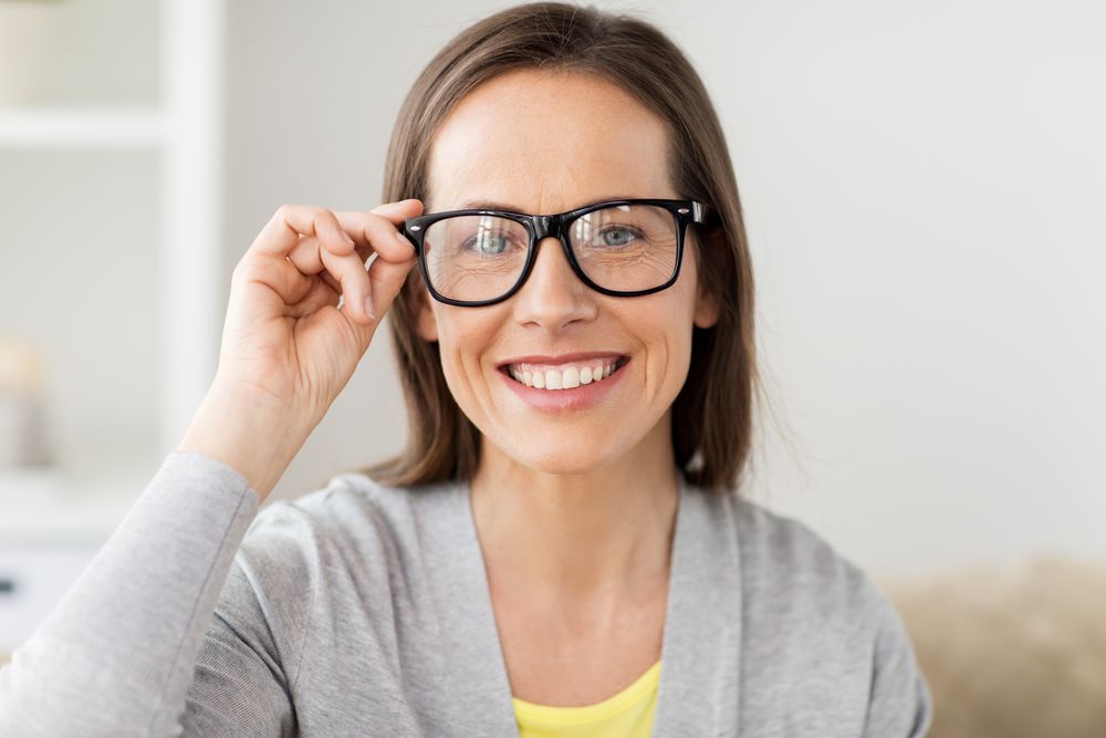 happy smiling middle aged woman in glasses at home 2021 08 26 22 49 53 utc 1
